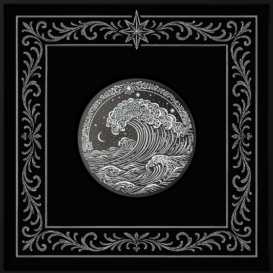 Decorative black square with intricate silver border and central design on a white background